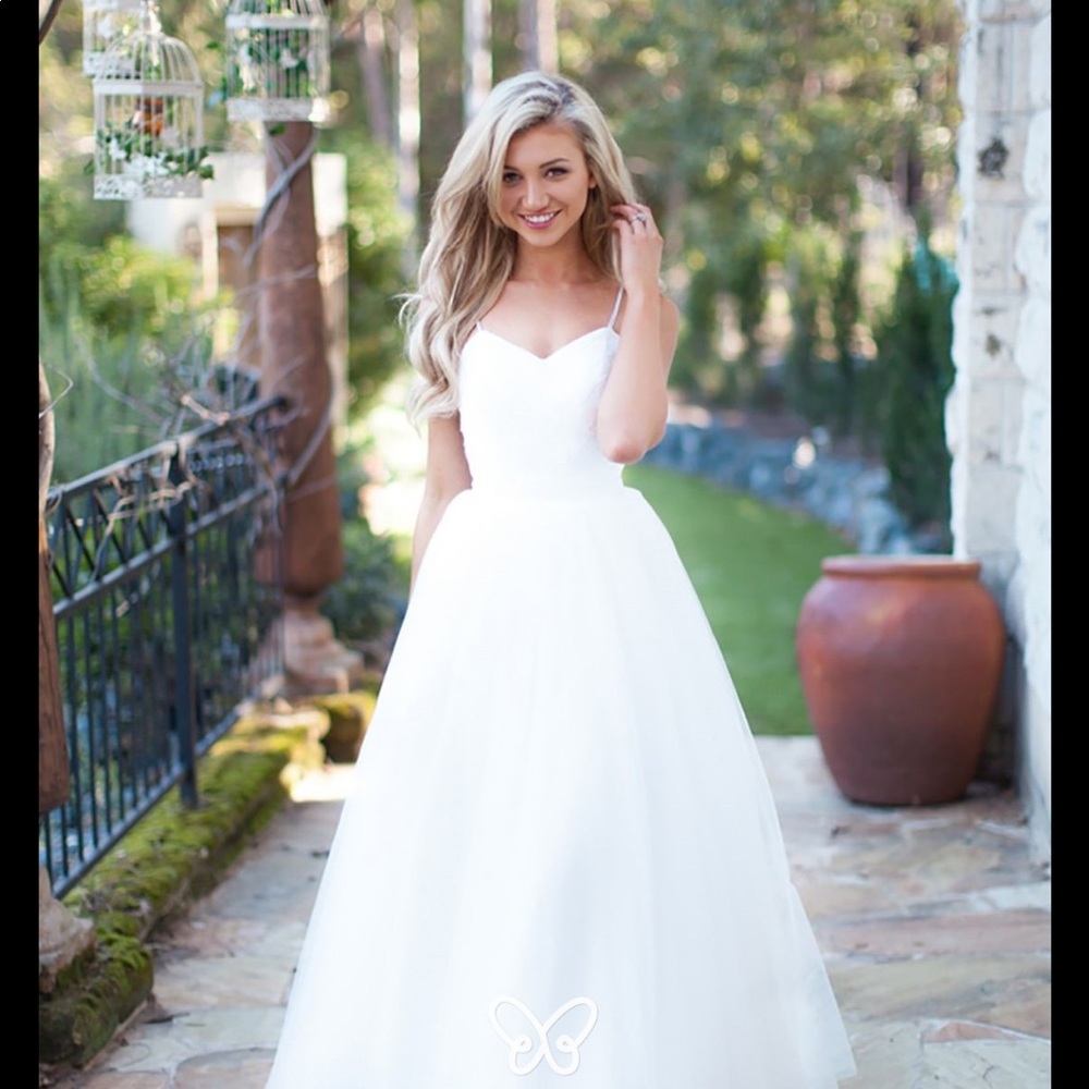 Wedding dress fits size 8 to 12 because of the adjustable back clean dress
